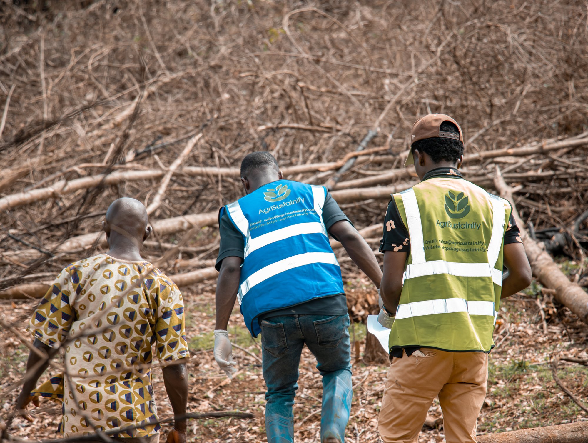 AgriSustainify team walking with local farmer